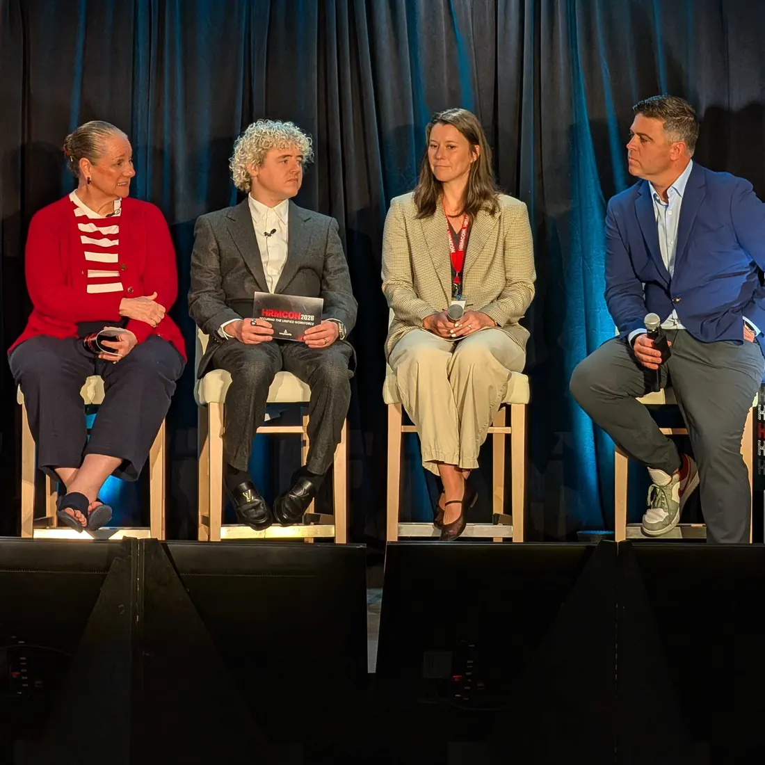 Four panelists in conversation on the HRMCon 2026 stage
