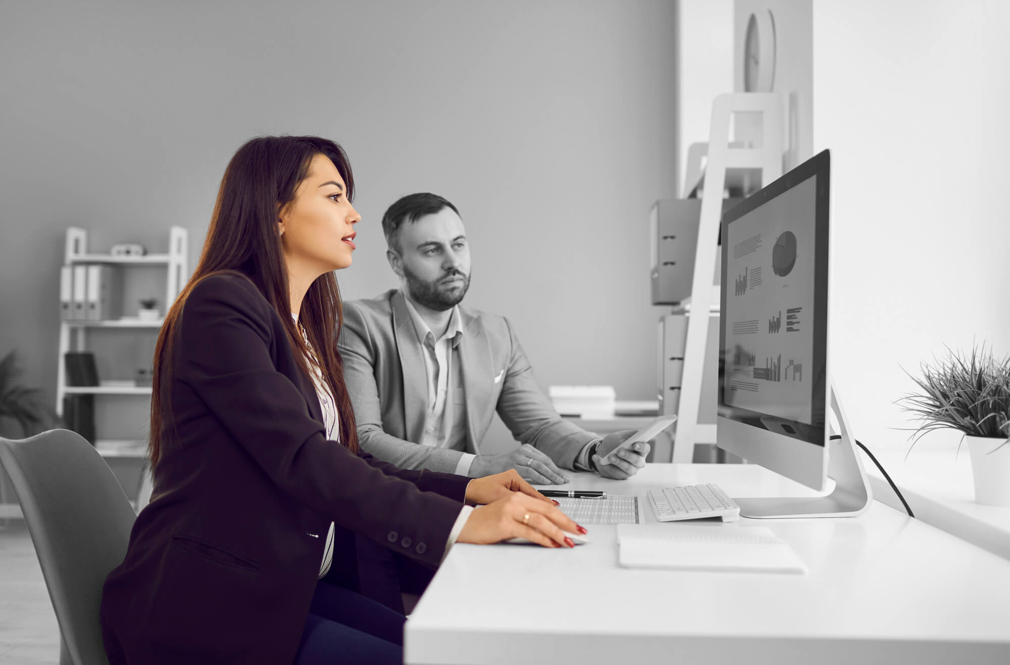 Team investigating a possible data breach on an office computer screen
